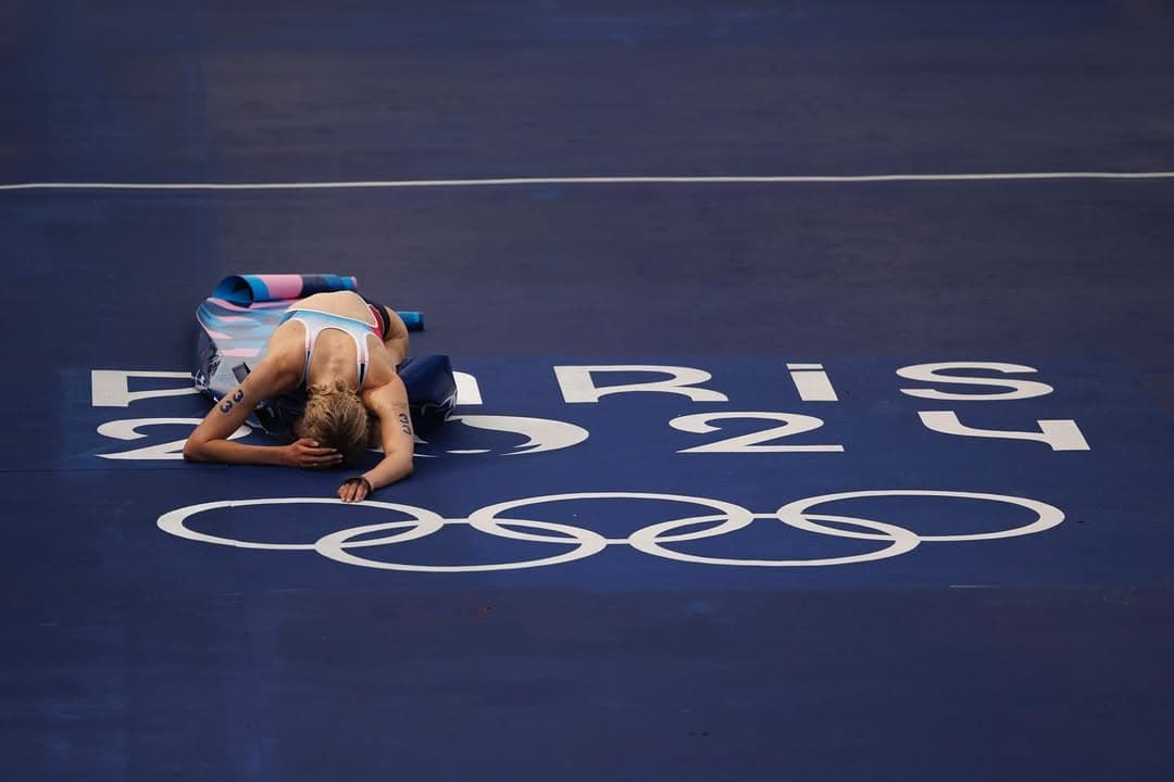 Cassandre Beaugrand collapsed on the Paris 2024 finish line, the Olympic rings beneath her.